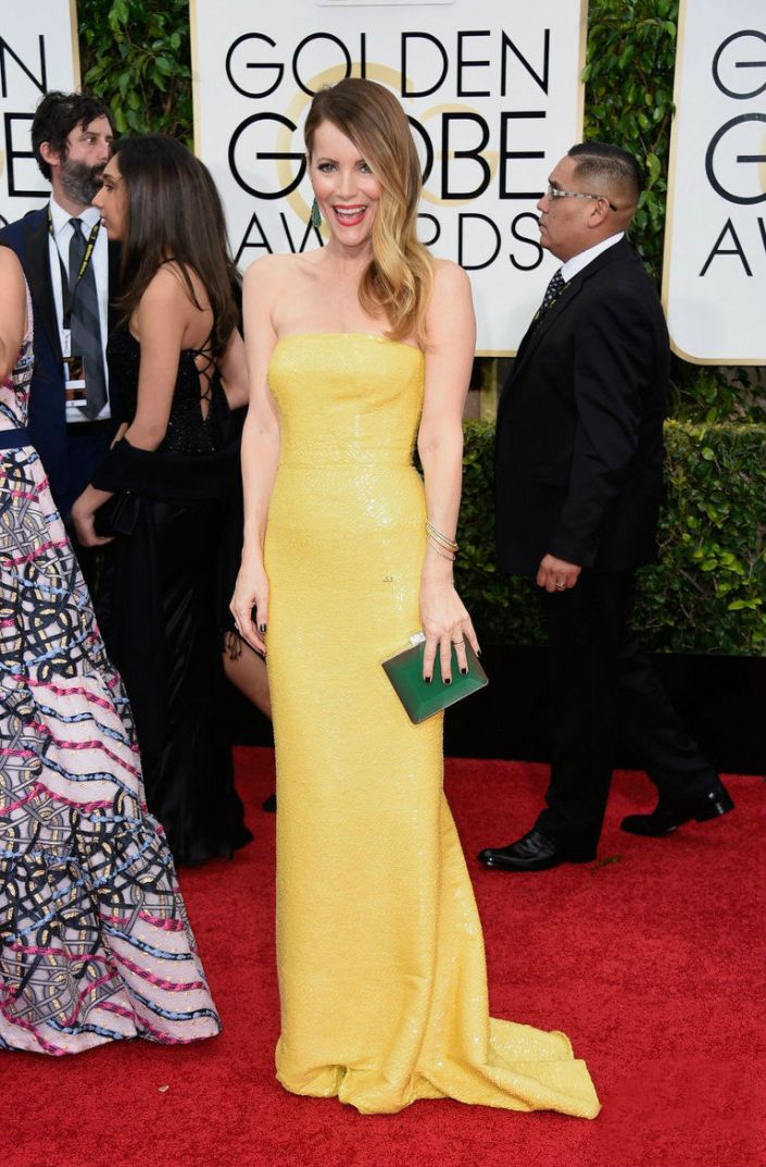 Leslie Mann is wearing a Kaufmanfranco dress Salvatore Ferragamo clutch and Kimberly McDonald earrings and bangles